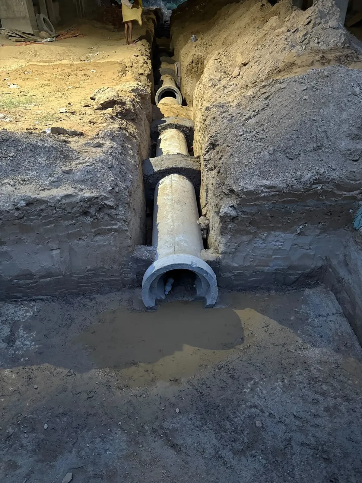Concrete pipe bedded in the trench