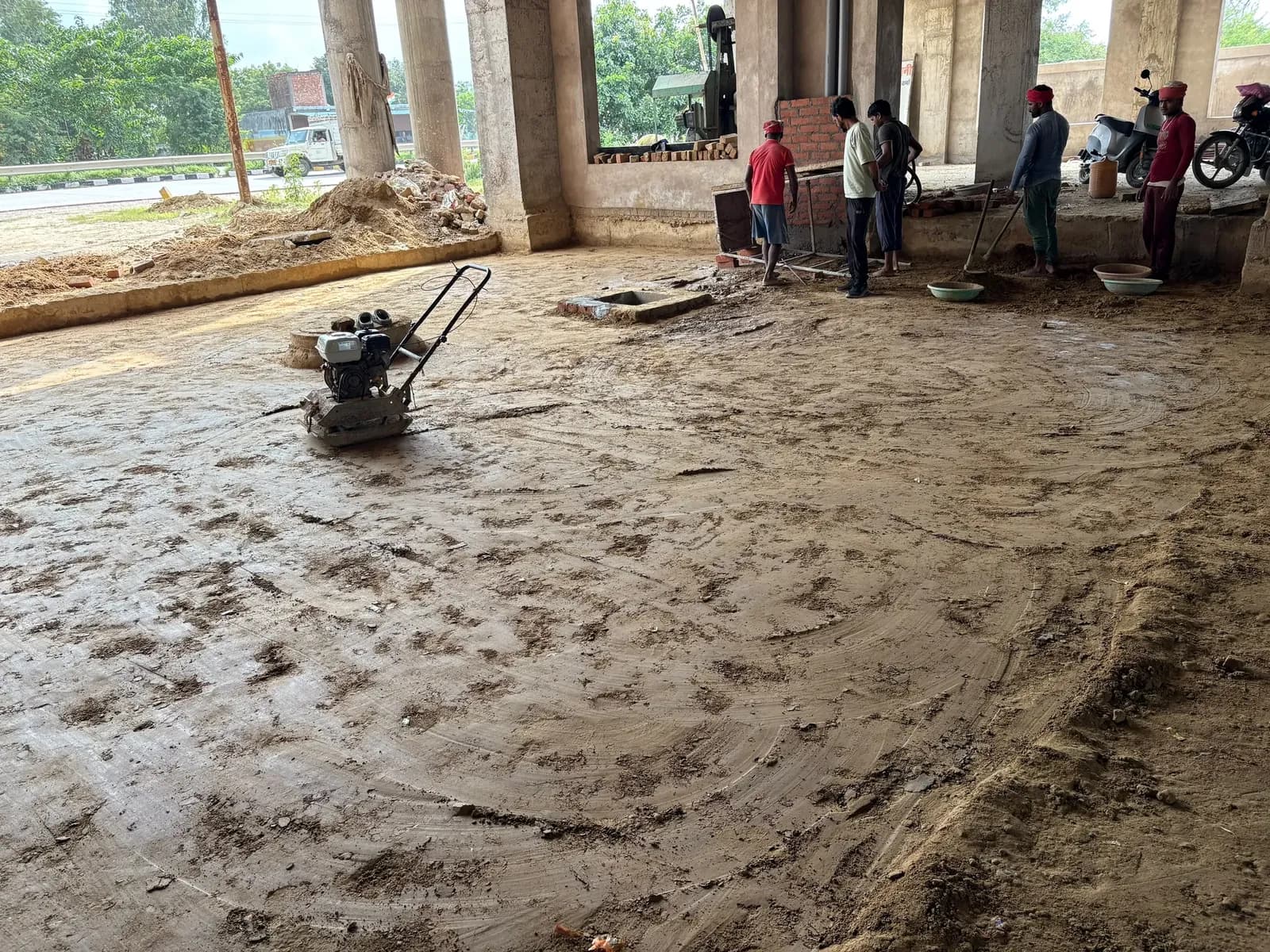 Plate compactor on the prepared floor