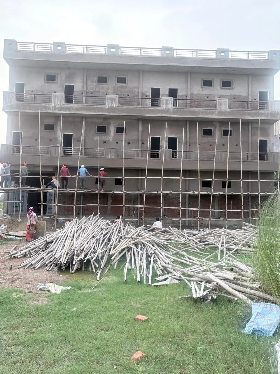 External plastering in progress on the lower floors