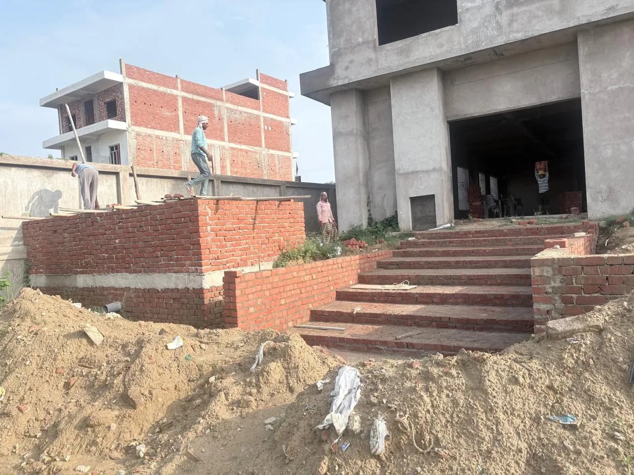 Brick entrance steps leading to the concrete building