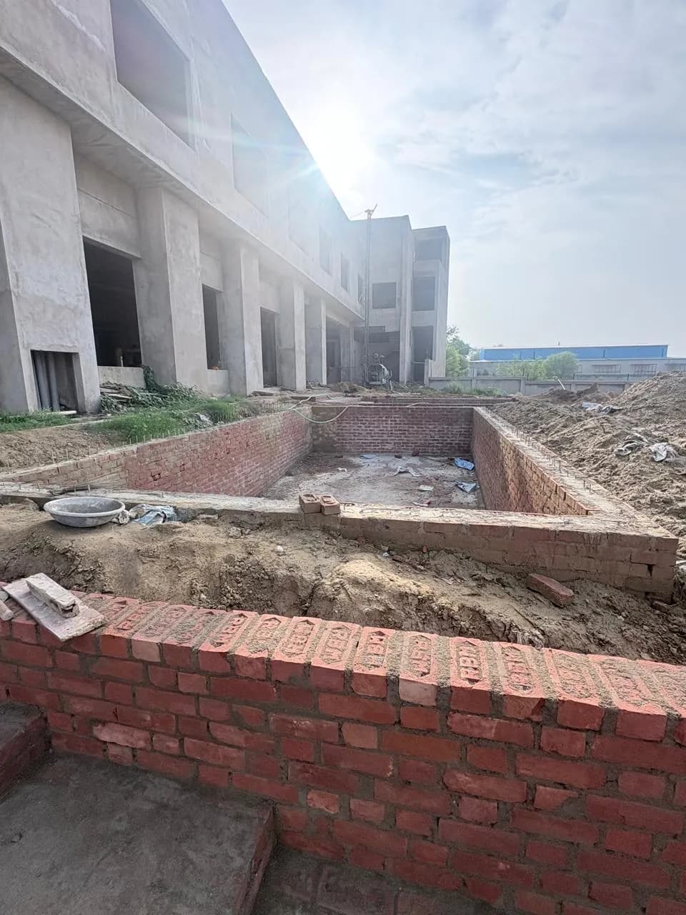 External brick works with the building's piers in the background