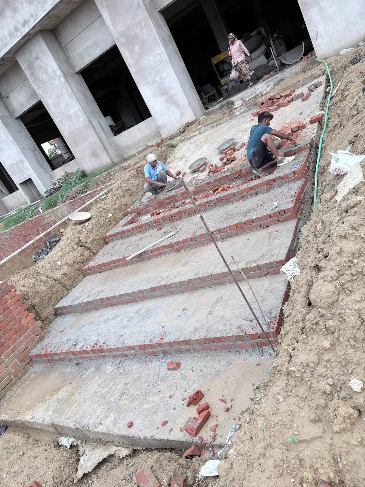 Brick edging and levelled surface along the external works