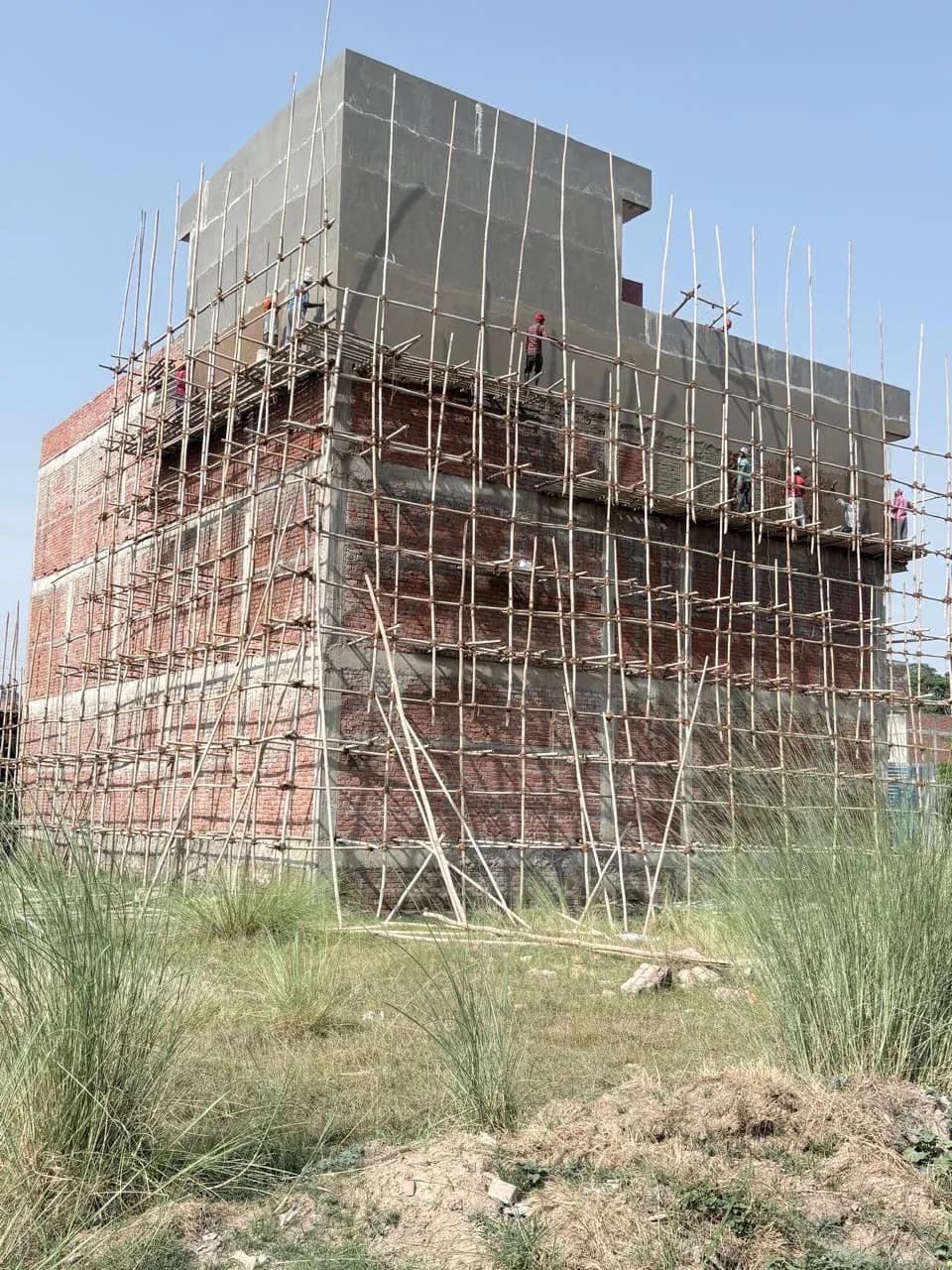 Brick walls under scaffolding before plastering