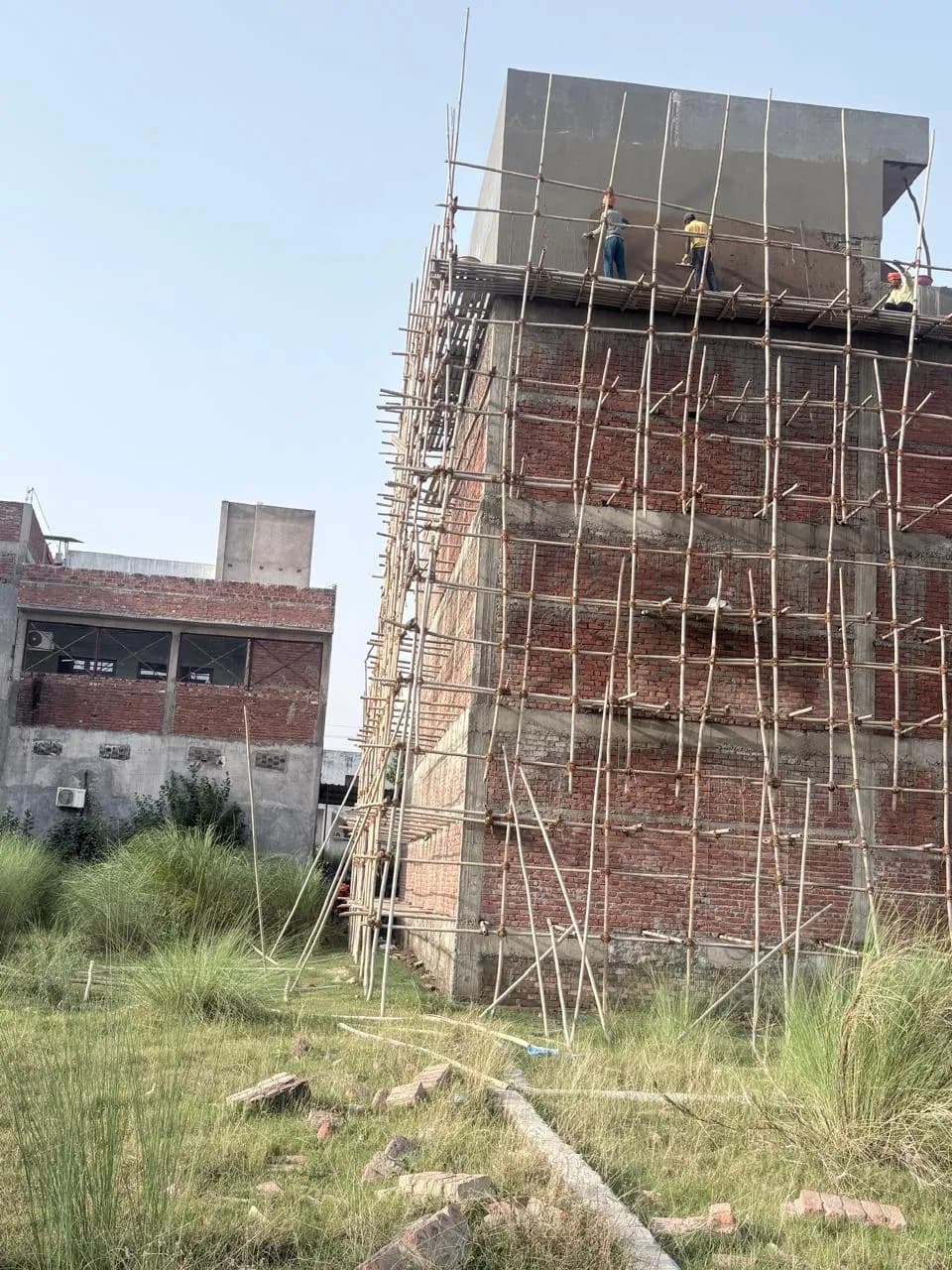 Scaffolding along the brick façade