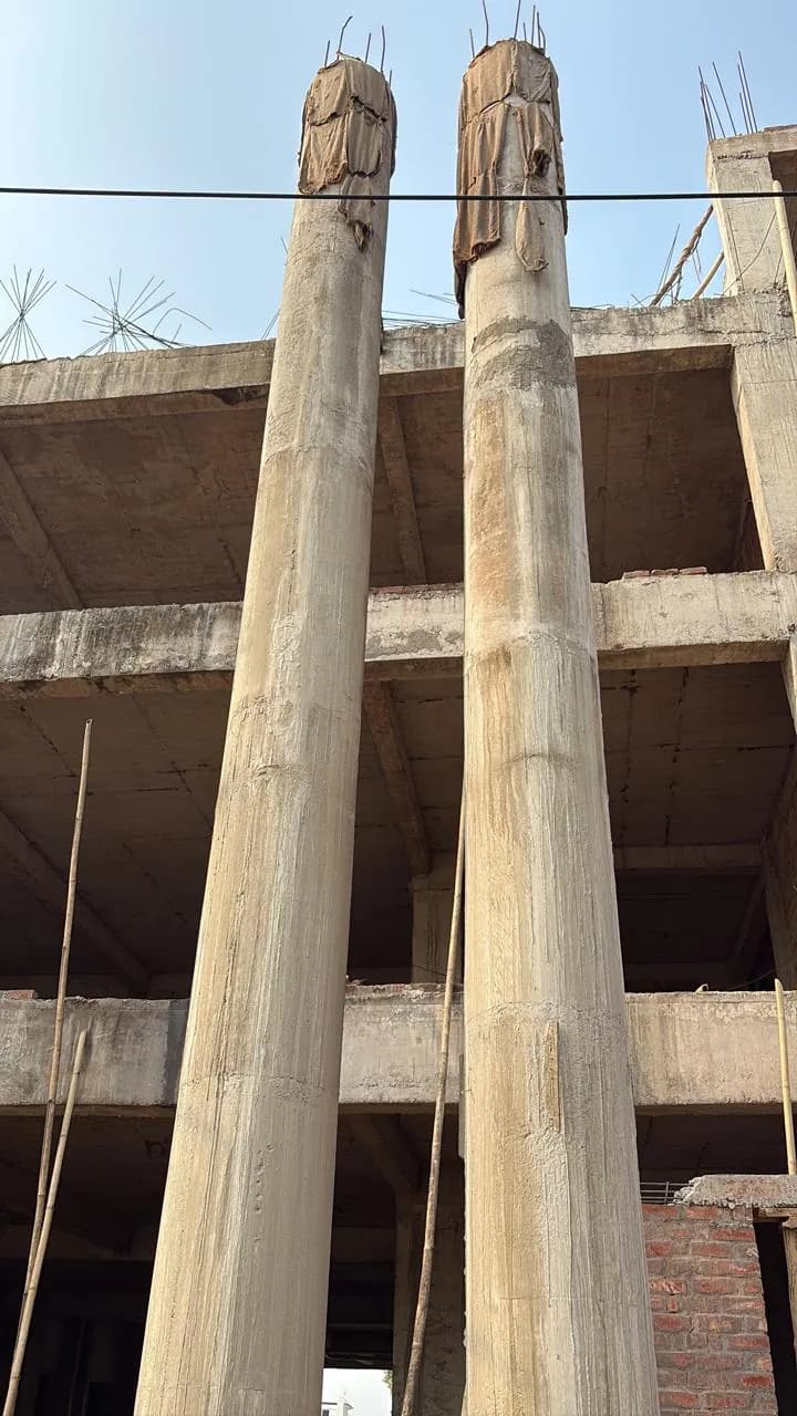 Tall RCC columns rising between floor slabs