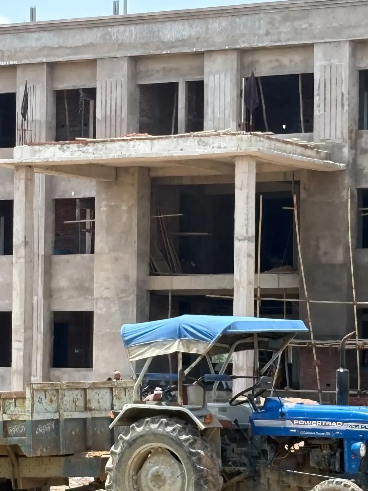 Portico columns with tractor and trolley on site