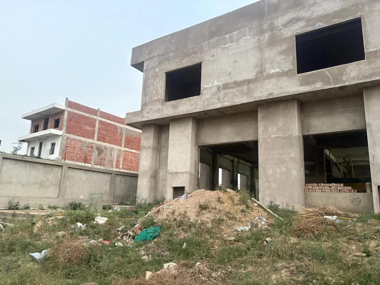Concrete building with deep square piers and large recessed openings